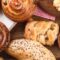 Breads,,Buns,,Croissants.,Bakery,Ingredients,On,Wooden,Background.,Breakfast,Food