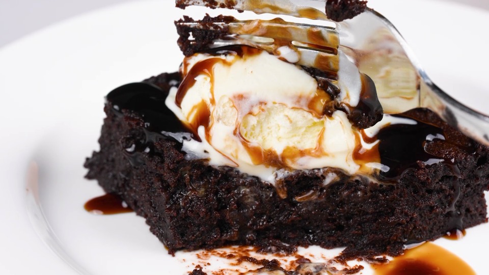 Chocolate Brownies Recipe topped with ice cream and chocolate